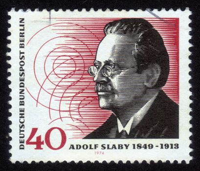 Germany - CIRCA 1974: A stamp printed in Germany, shows a portrait of Adolf Karl Heinrich Slaby (1849-1913), was a German wireless pioneer and the first Professor of electro-technology at the Technical University of Berlin, circa 1974