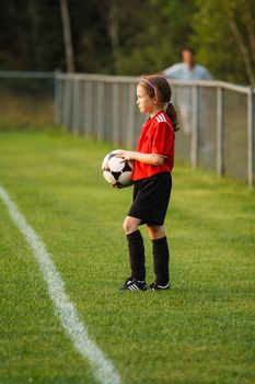 Young girl with a soccer ball