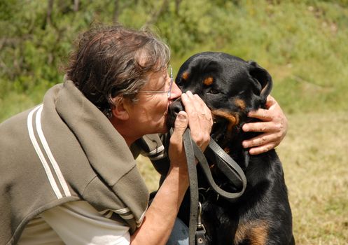 man and his best friend purebred rottweiler
