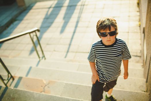 Boy with an attitude climbing stairs