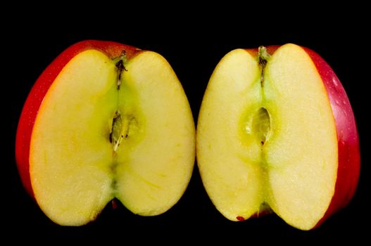 sliced apples on black background