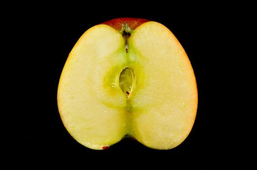 sliced apples on black background