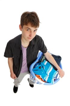 A teenager holds a basket of clothing.  White background.