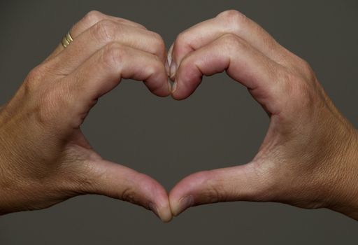hands making a hart shape together