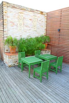 Green table setting on rooftop outdoor