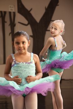 Pair of young female ballet students looking cute