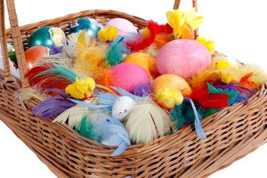 Basket with easter eggs on white background