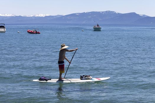 Cruising on a stand-up surfer in Lake Tahoe, CA.