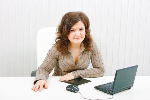 in the office of a young woman with a laptop