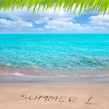 Caribbean tropical beach with Summer word written in sand