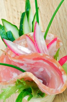 Appetizer of Salchichon, Cucucmber and Radish closeup