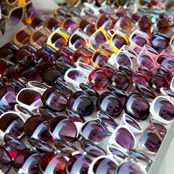 Fashion sunglasses rows in outdoor shop display pattern