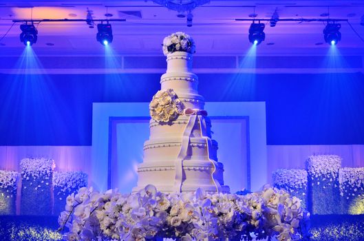 Wedding cake with stage lighting in wedding ceremony