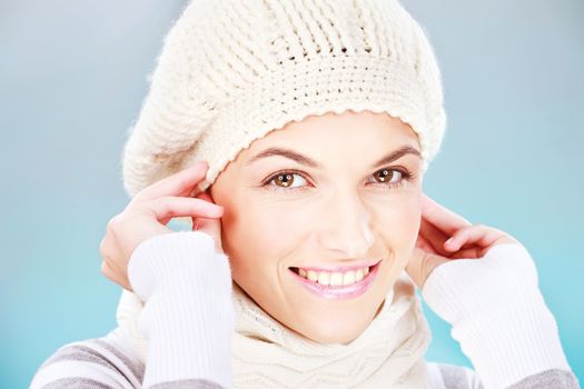 pretty woman with scarf and winter cap