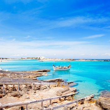 Els Pujols beach in Formentera with traditional fishing boat in summer day