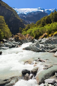 Beautiful glacial river running off hanging Rob Roy Glacier in Mount Aspiring National Park, Southern Alps, New Zealand