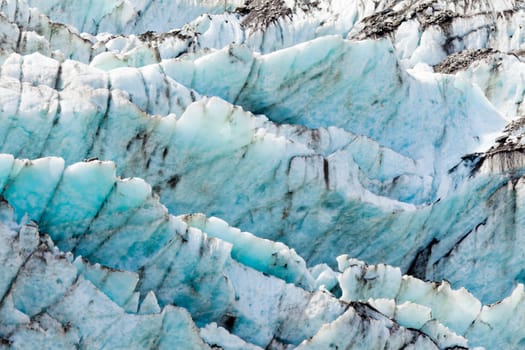 Blue turquoise glacier icefall frozen ice background texture pattern