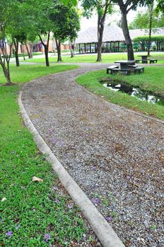 The curvy walk way of a city park 