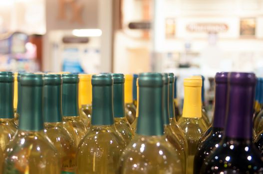 Wine bottles shot with limited depth of field on display in a liquor store