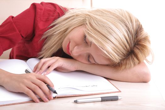 Young woman sleeping in office