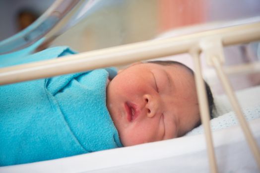 Asian Newborn baby girl 1 day after the birth, in hospital.
