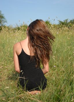 very slim young girl in a field
