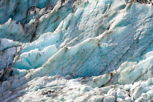 Blue turquoise glacier icefall frozen ice background texture pattern