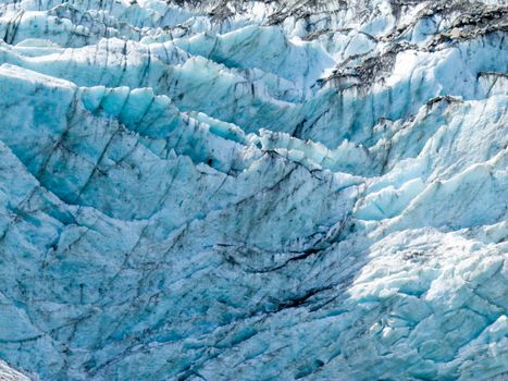 Blue turquoise glacier icefall frozen ice background texture pattern