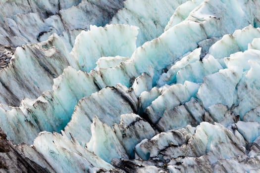Blue turquoise glacier icefall frozen ice background texture pattern