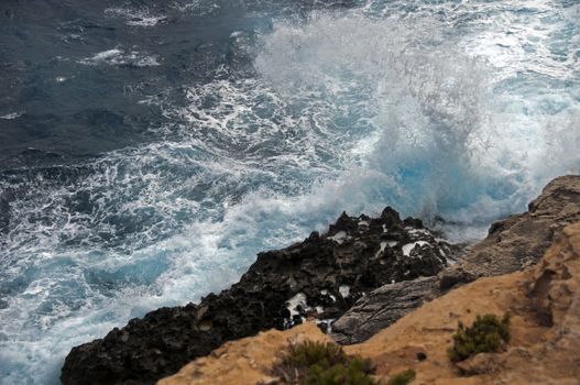 heavy waves on the island Malta with very blue water