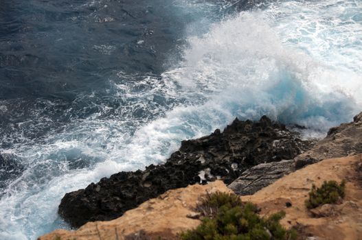 heavy waves on the island Malta with very blue water