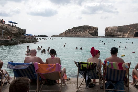 GOZO,MALTA - SEPTEMBER 25: Unidentified people relaxing at the blue beach on September 25, 2011 in Gozo, Malta. Blue beach is the most popular tourist beach on Malta