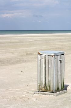 Garbage can on Jammerbugt beach in the north of Denmark. Sunny August 2010.