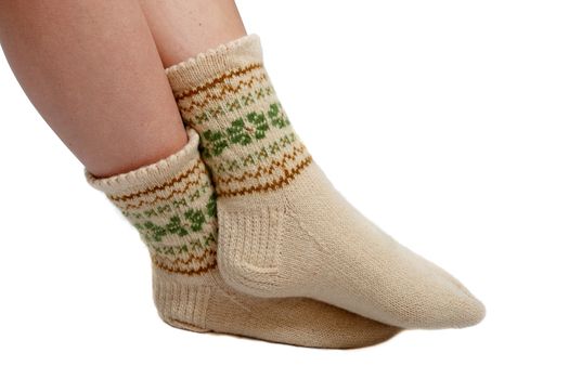 warm hand knitted wool socks on women foot