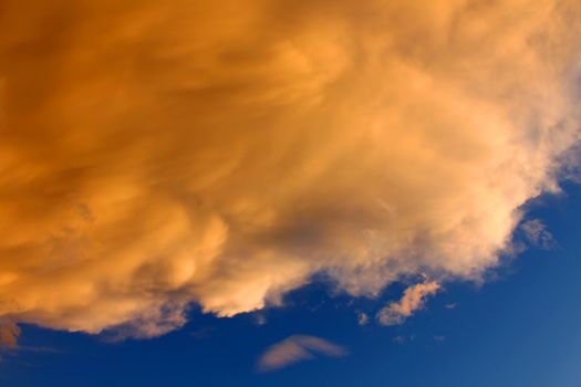 Bright sunlit clouds over deep blue skies over northern Montana.