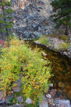 Stream ripples through rocky cliffs in the Lewis and Clark National Forest of Montana.