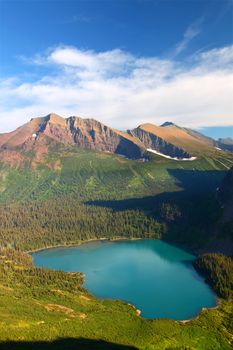 Grinnell Lake amidst the majestic mountain scenery of Glacier National Park in Montana.