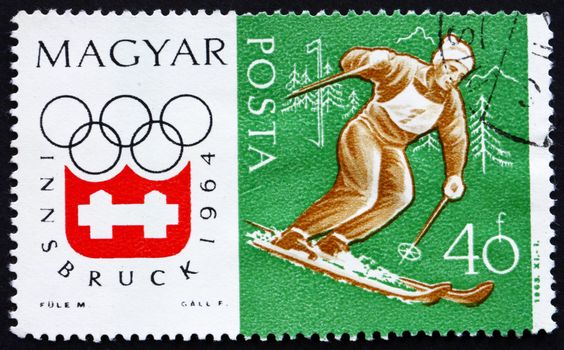 HUNGARY - CIRCA 1963: a stamp printed in the Hungary shows Slalom, Alpine Skiing, Winter Olympic sports, Innsbruck 64, circa 1963