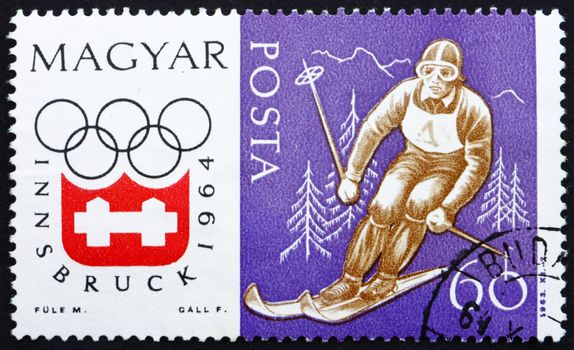 HUNGARY - CIRCA 1963: a stamp printed in the Hungary shows Downhill Skiing, Winter Olympic sports, Innsbruck 64, circa 1963