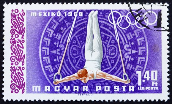 HUNGARY - CIRCA 1968: a stamp printed in the Hungary shows Gymnast on Rings, Summer Olympic sports, Mexico 68, circa 1968