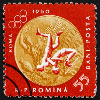 ROMANIA - CIRCA 1961: a stamp printed in the Romania shows Wrestling, Summer Olympic sports, Roma 60, circa 1961