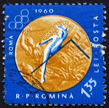 ROMANIA - CIRCA 1961: a stamp printed in the Romania shows Woman�s High Jump, Summer Olympic sports, Roma 60, circa 1961