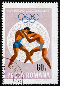 ROMANIA - CIRCA 1968: a stamp printed in the Romania shows Wrestling, Summer Olympic sports, Mexico 68, circa 1968
