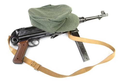 Germany in the Second World War. Composition with standard army field cap (kepi) and submachine gun MP40 