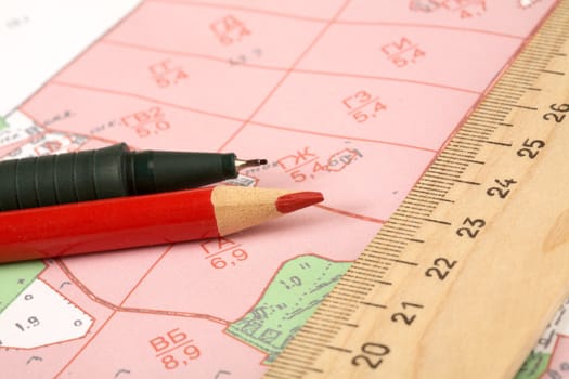 Topographic map of district with  ruler and a pencil