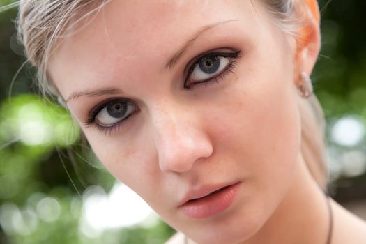 Portrait of the beautiful girl close up