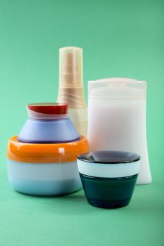 Tubes with  cosmetic cream on a green background
