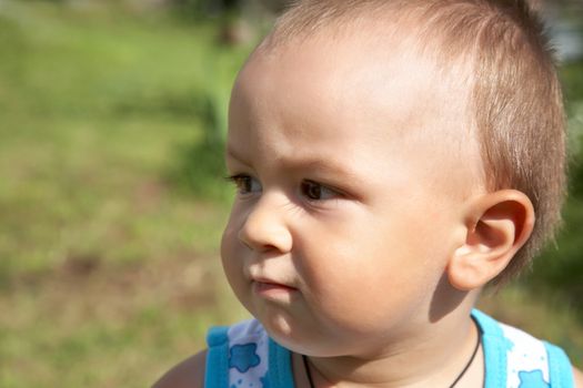 Portrait of the little boy in  afternoon summer