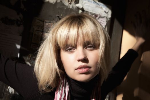 Girl's face close up shined with a sunlight