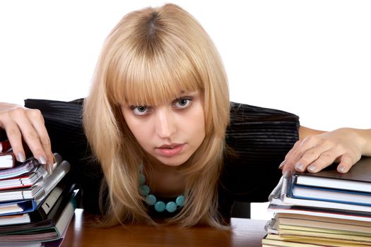 The girl with two piles of writing-books isolated on a white background
